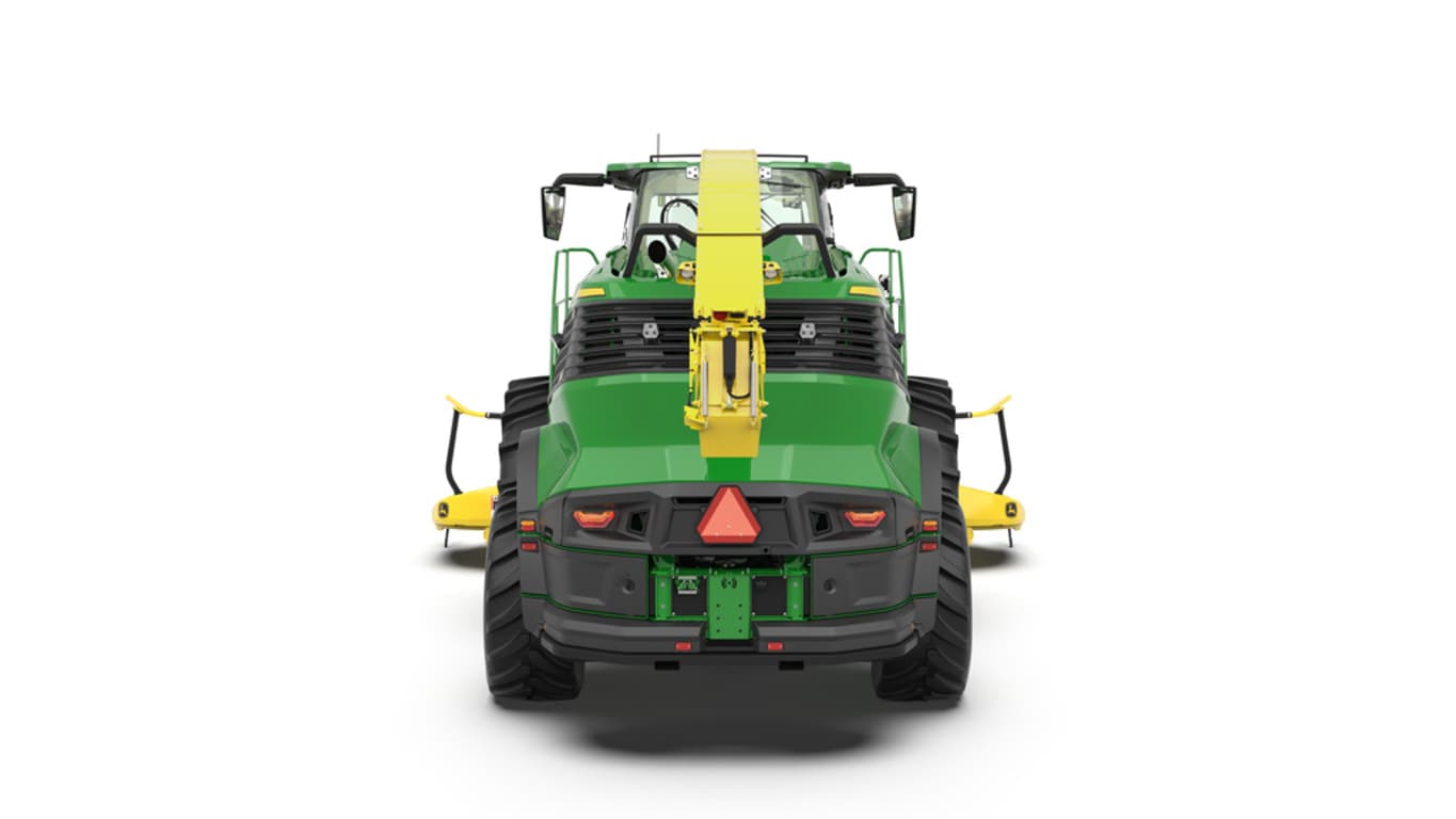 A rear-facing green F8 500 self-propelled forage harvester with a yellow header on a white background.
