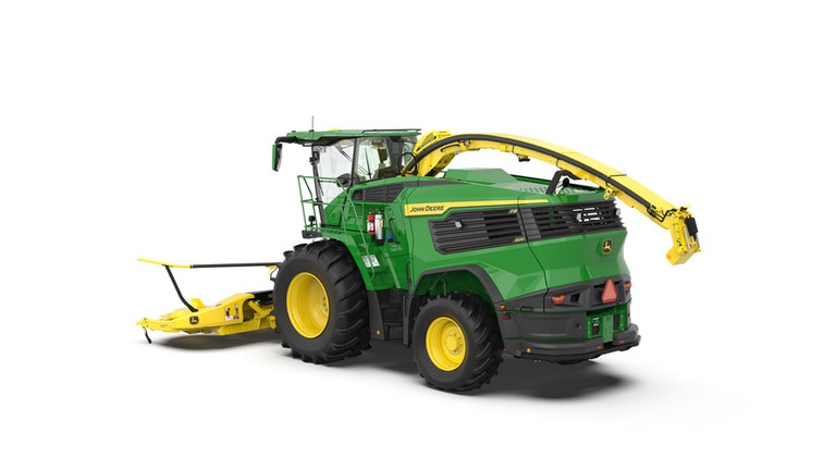 A rear-left-facing green F8 600 self-propelled forage harvester with a yellow header on a white background.