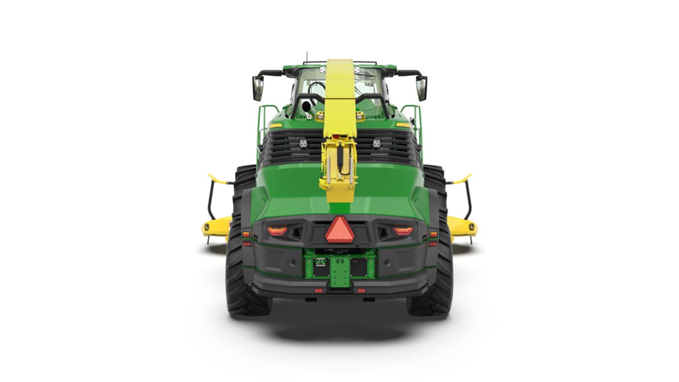 A rear-facing green F8 600 self-propelled forage harvester with a yellow header on a white background.