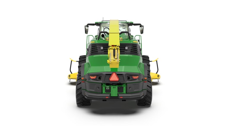 A rear-facing green F8 600 self-propelled forage harvester with a yellow header on a white background.