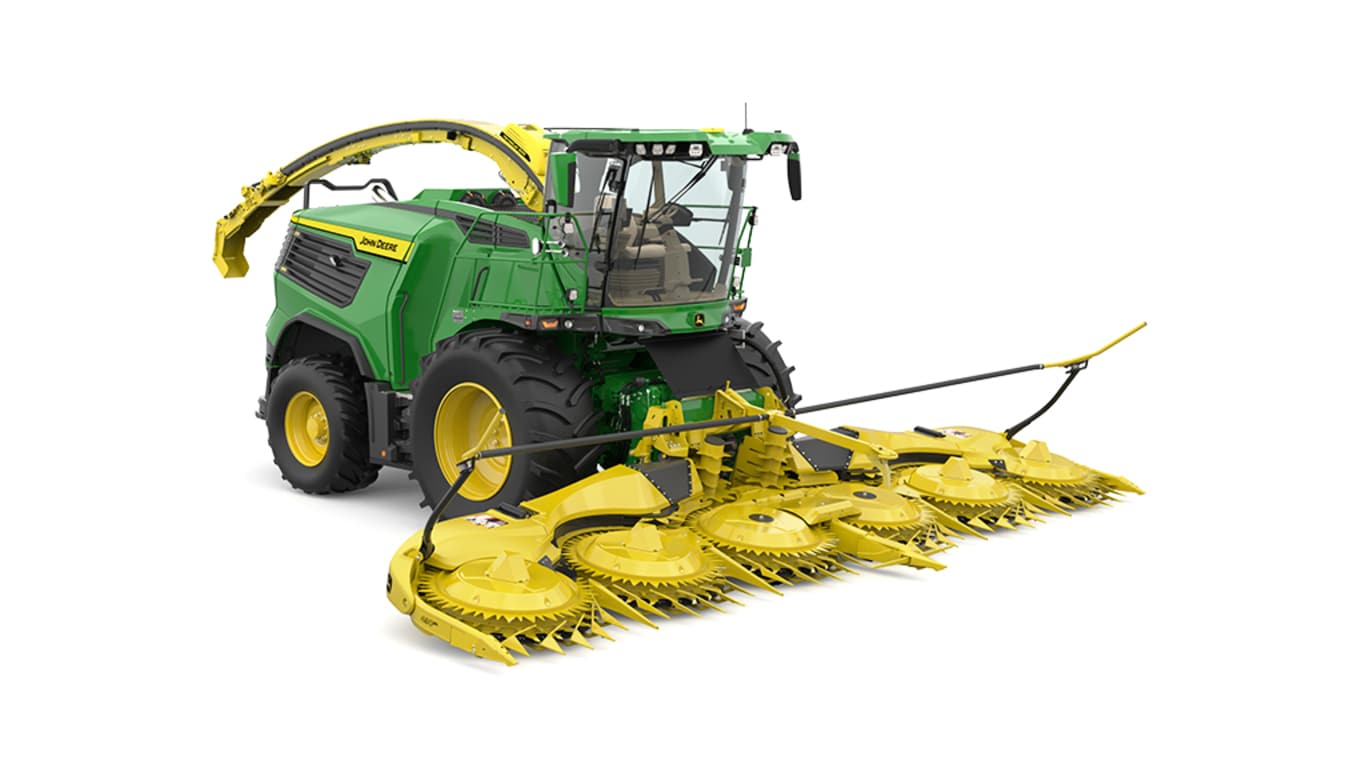A front-right-facing green F9 1000 self-propelled forage harvester with a yellow header on a white background.