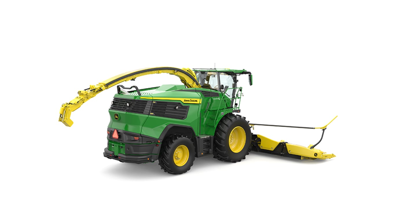 A rear-right-facing green F9 1000 self-propelled forage harvester with a yellow header on a white background.