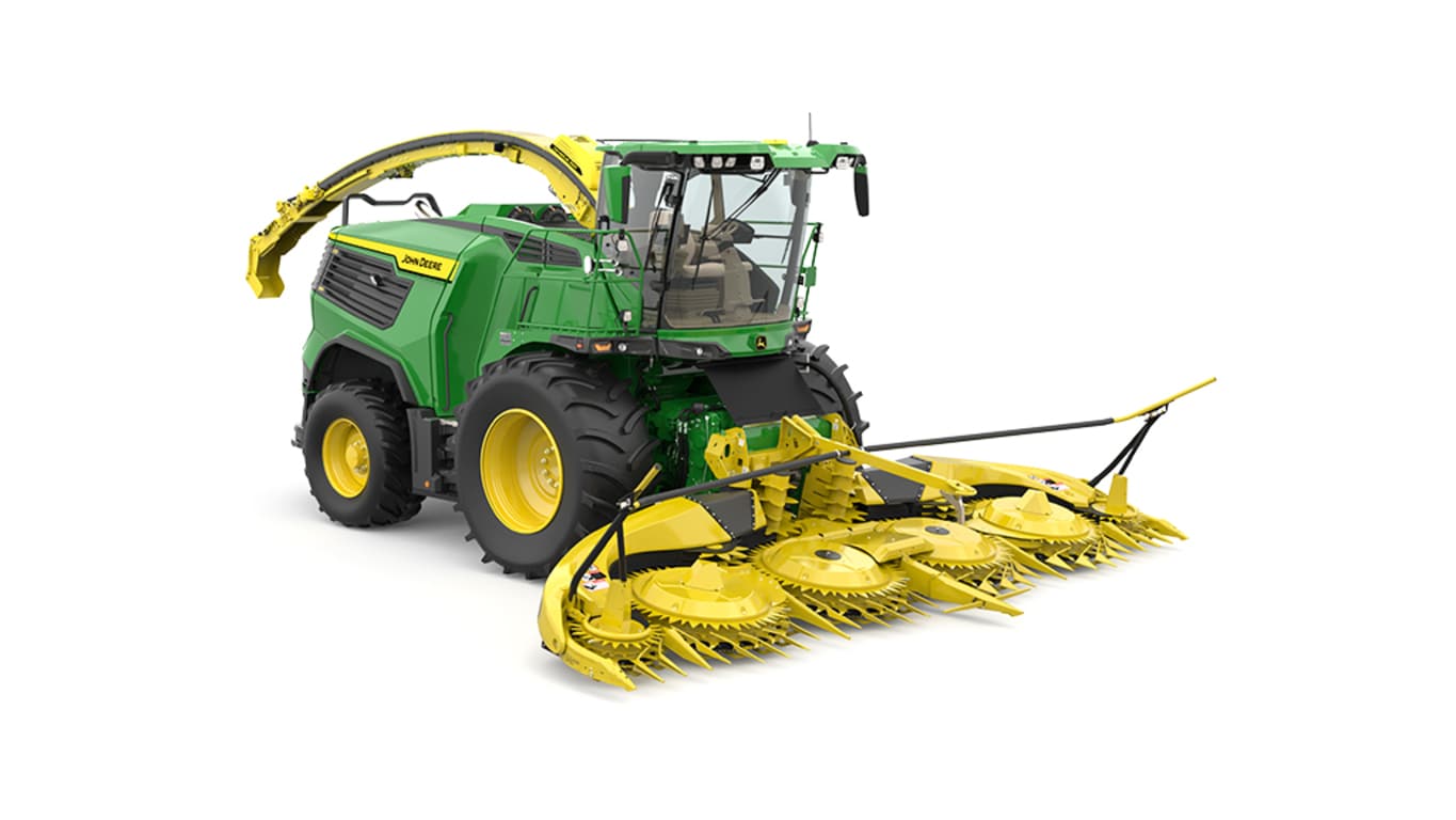 A front-right-facing green F9 500 self-propelled forage harvester with a yellow header on a white background.