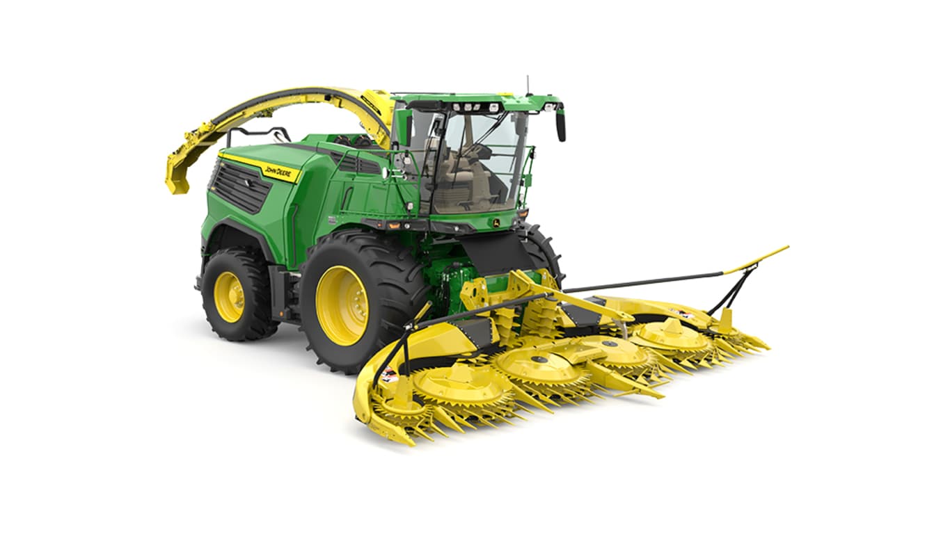 A front-right-facing green F9 600 self-propelled forage harvester with a yellow header on a white background.