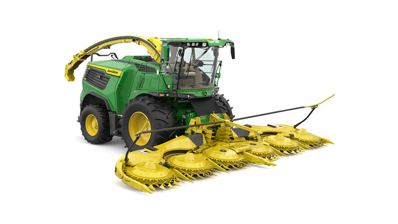 A front-right-facing green F9 700 self-propelled forage harvester with a yellow header on a white background.