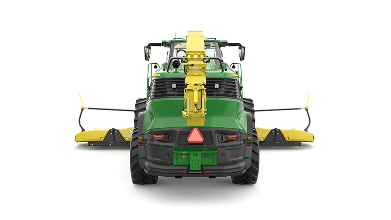 A rear-facing green F9 900 self-propelled forage harvester with a yellow header on a white background.