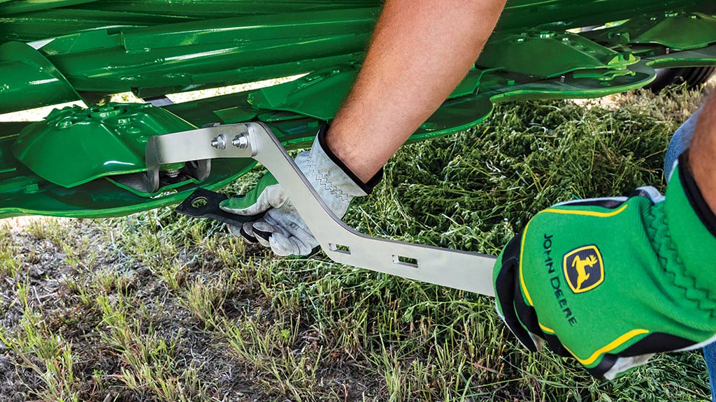 tractor and mower conditioner in a field