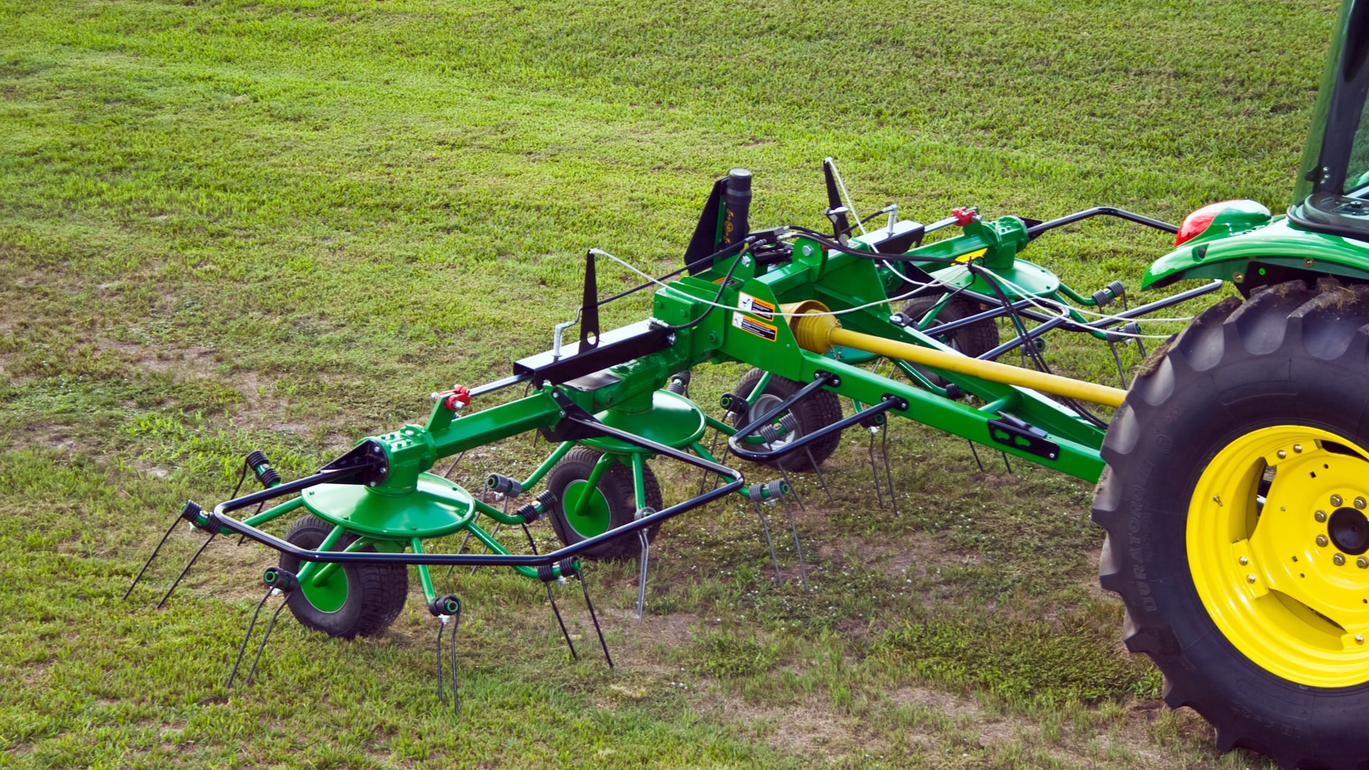 Hay Tedder moving through field