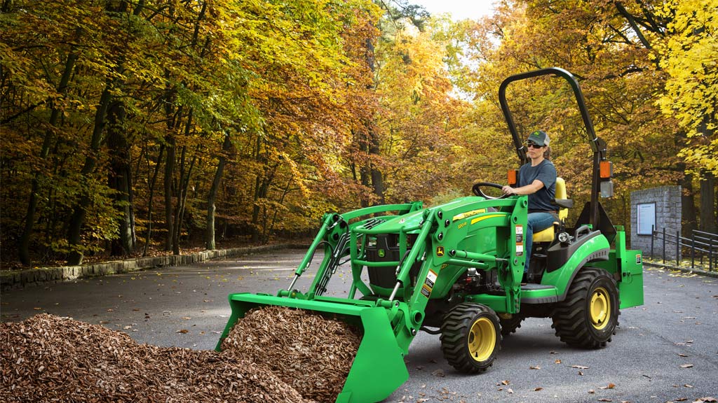 tractor with front end loader lifting mulch