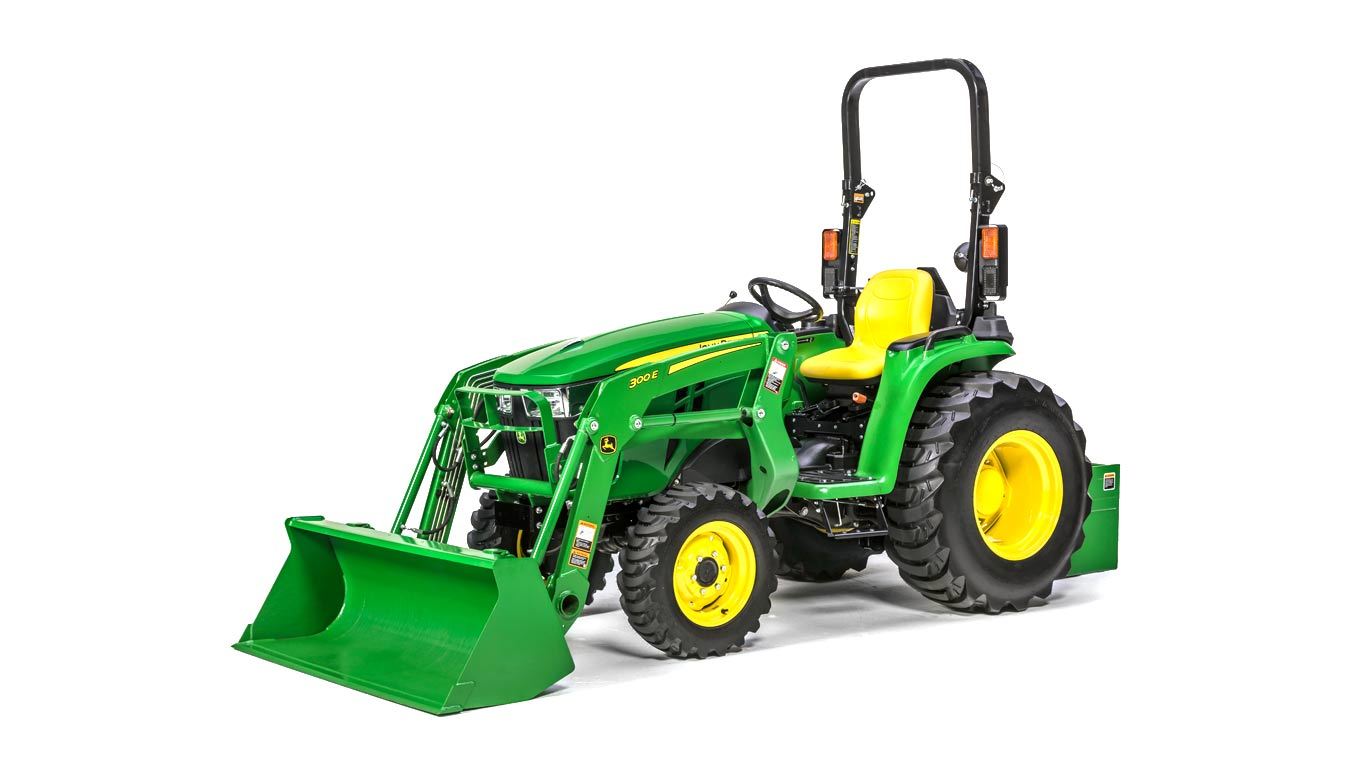 image of 300e front end loader attached to tractor in studio setting