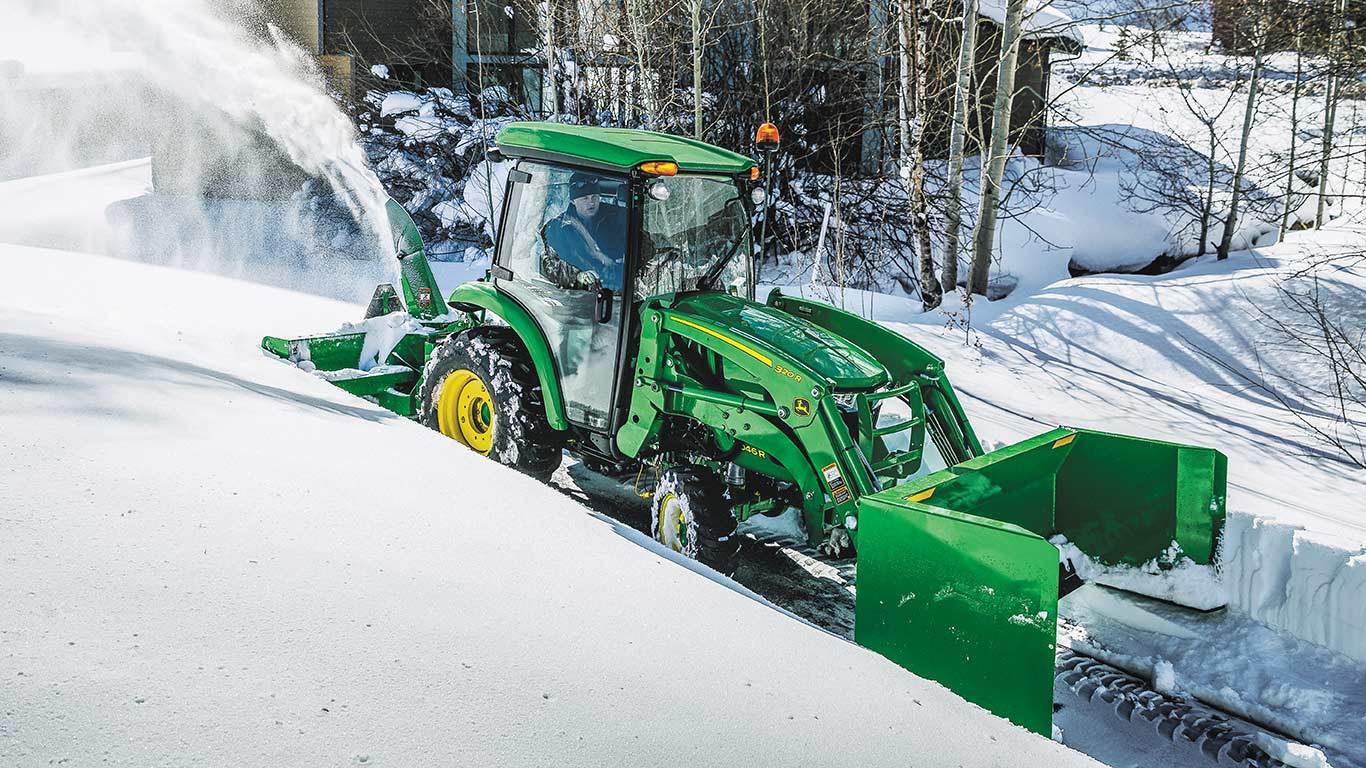 320R loader clearing snow