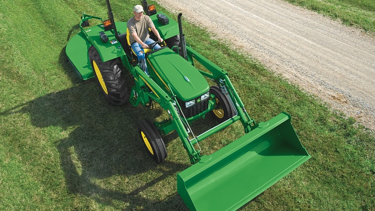 Ford Lgt 145 Garden Tractor Front End Loader And Landscape Rake At Work Youtube