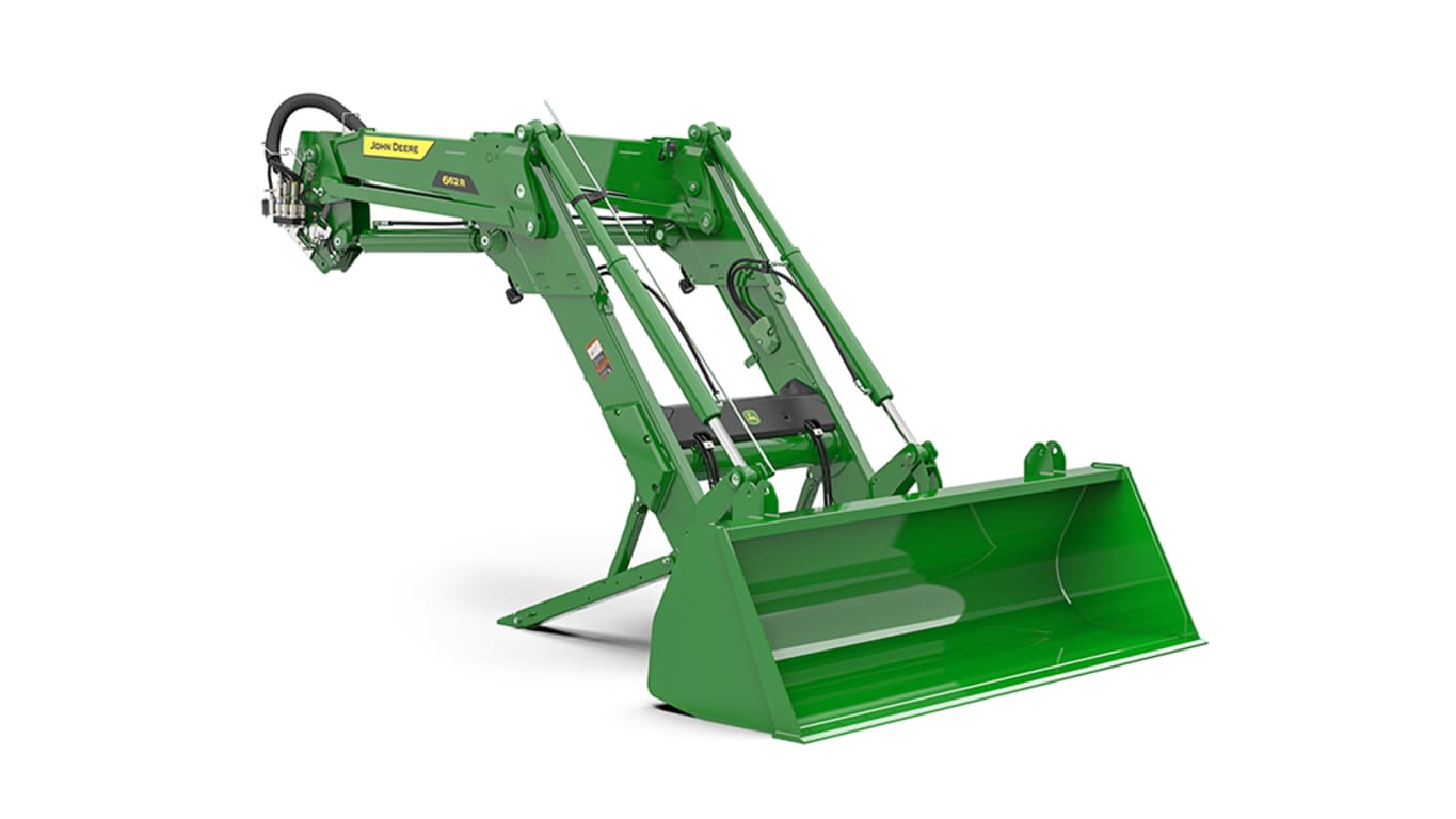Studio shot of a front-right-facing green loader on a white background.
