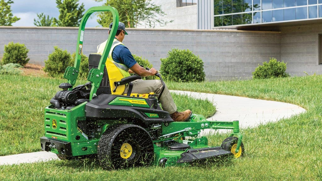 Person operating a Z970R Zero Turn Mower to cut grass