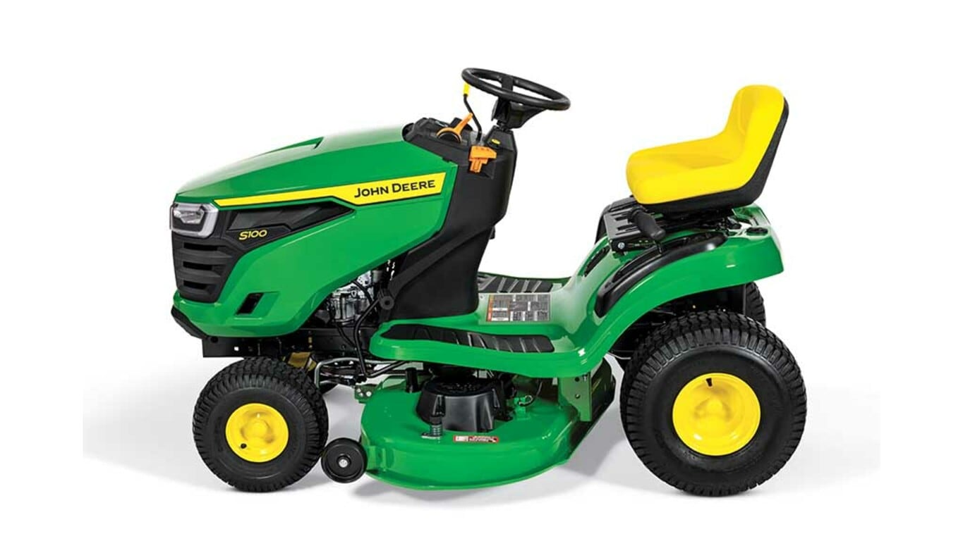A left-facing green riding mower with a yellow seat and green mowing deck on a white background.