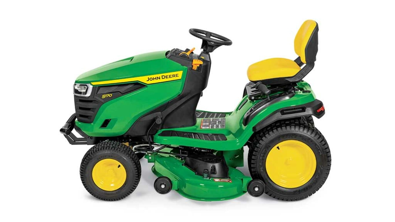 A left-facing green riding mower with a yellow seat and green mowing deck on a white background.