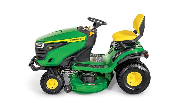 A left-facing green riding mower with a yellow seat and green mowing deck on a white background.