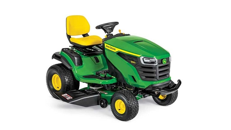 A front-right-facing green riding mower with a yellow seat and green mowing deck on a white background.