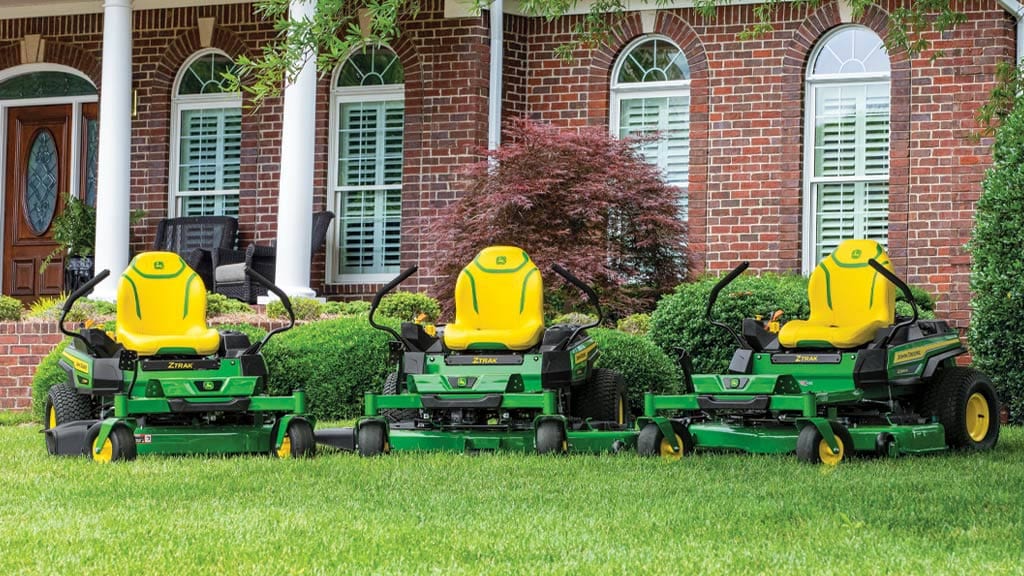 image of 3 zero-turn mowers