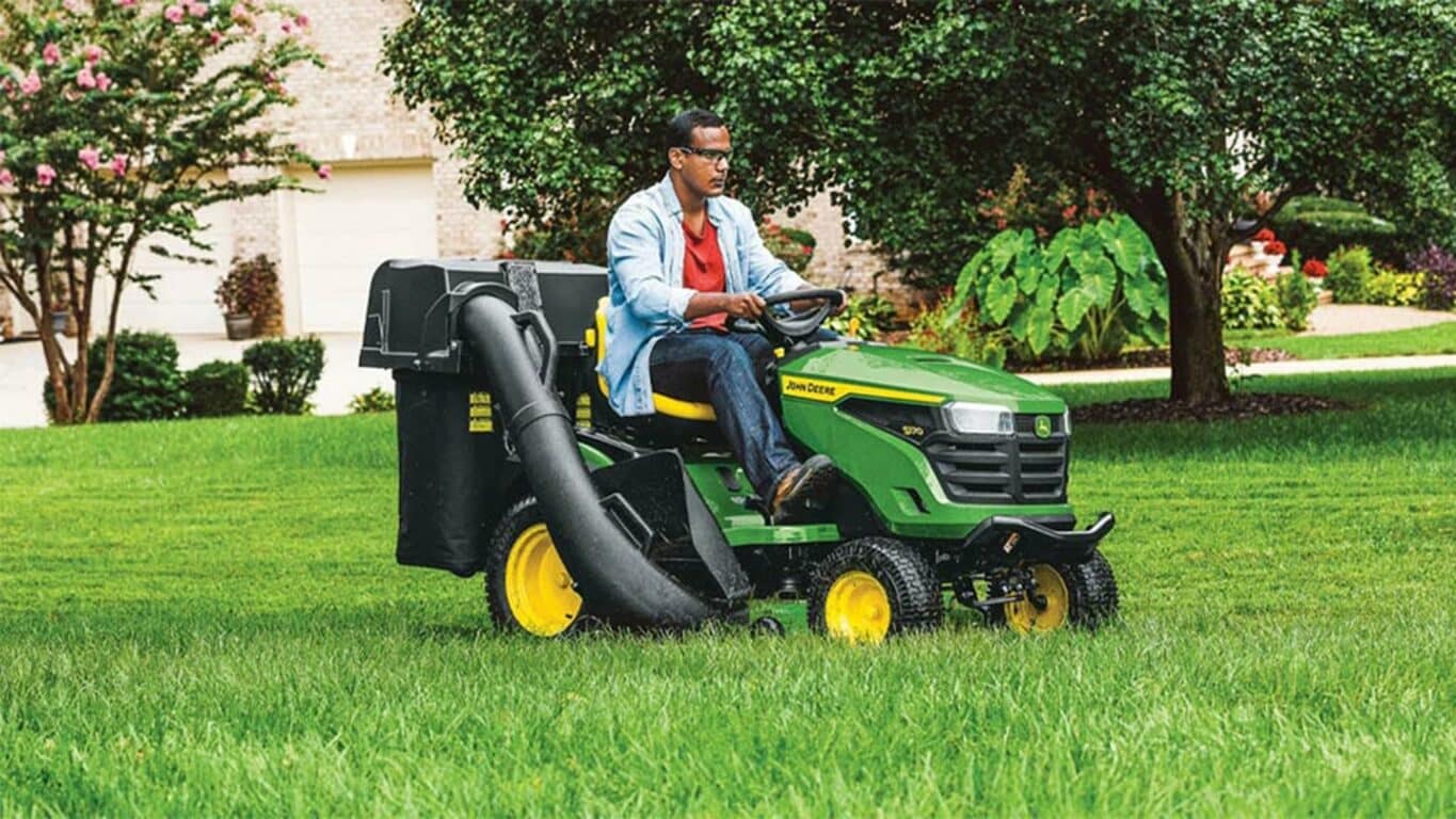 Person riding on a S170 mower using a bagger