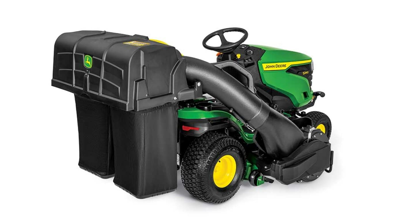 A rear-right-facing green riding mower with a bagging attachment and green 42" mowing deck on a white background.
