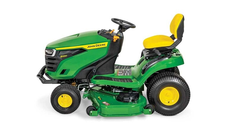 A left-facing green riding mower with a yellow seat and green 48" mowing deck on a white background.