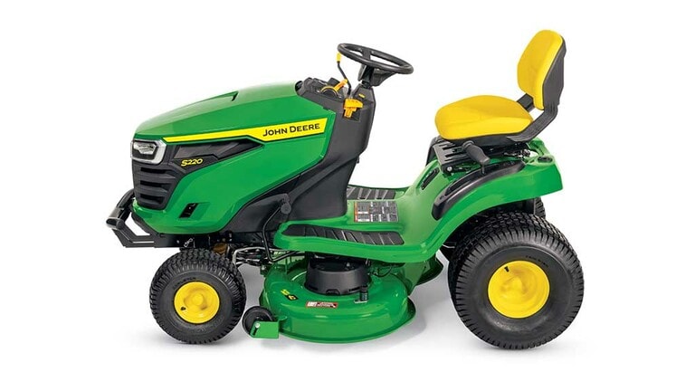 A left-facing green riding mower with a yellow seat and green 42" mowing deck on a white background.
