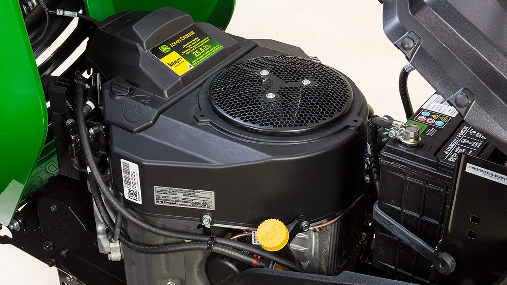 man mowing lawn by side of a house