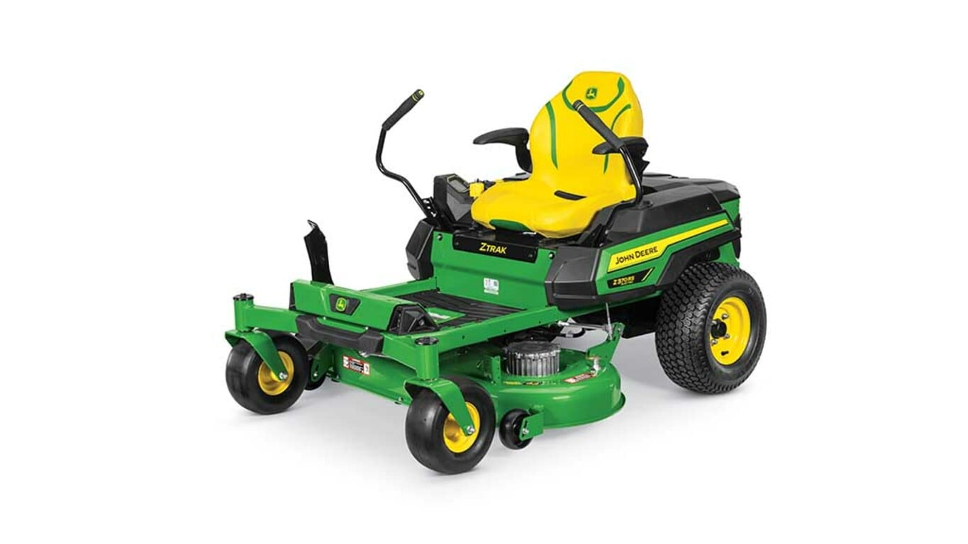 A front-left-facing green zero-turn mower with a yellow seat and green mowing deck on a white background.