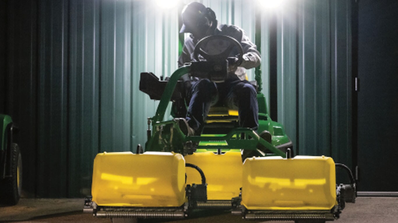 Triplex Mower next to maintenance shop