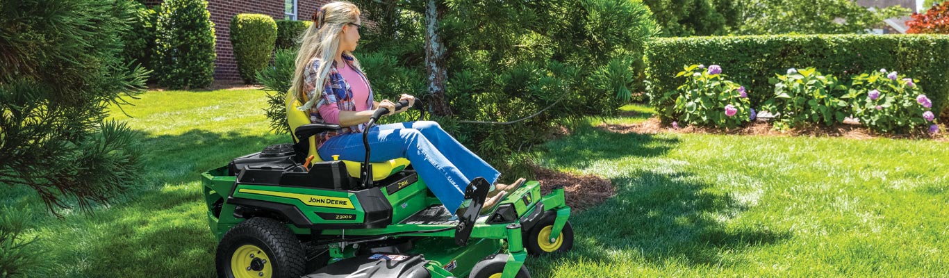 woman mowing lawn on a Z330R
