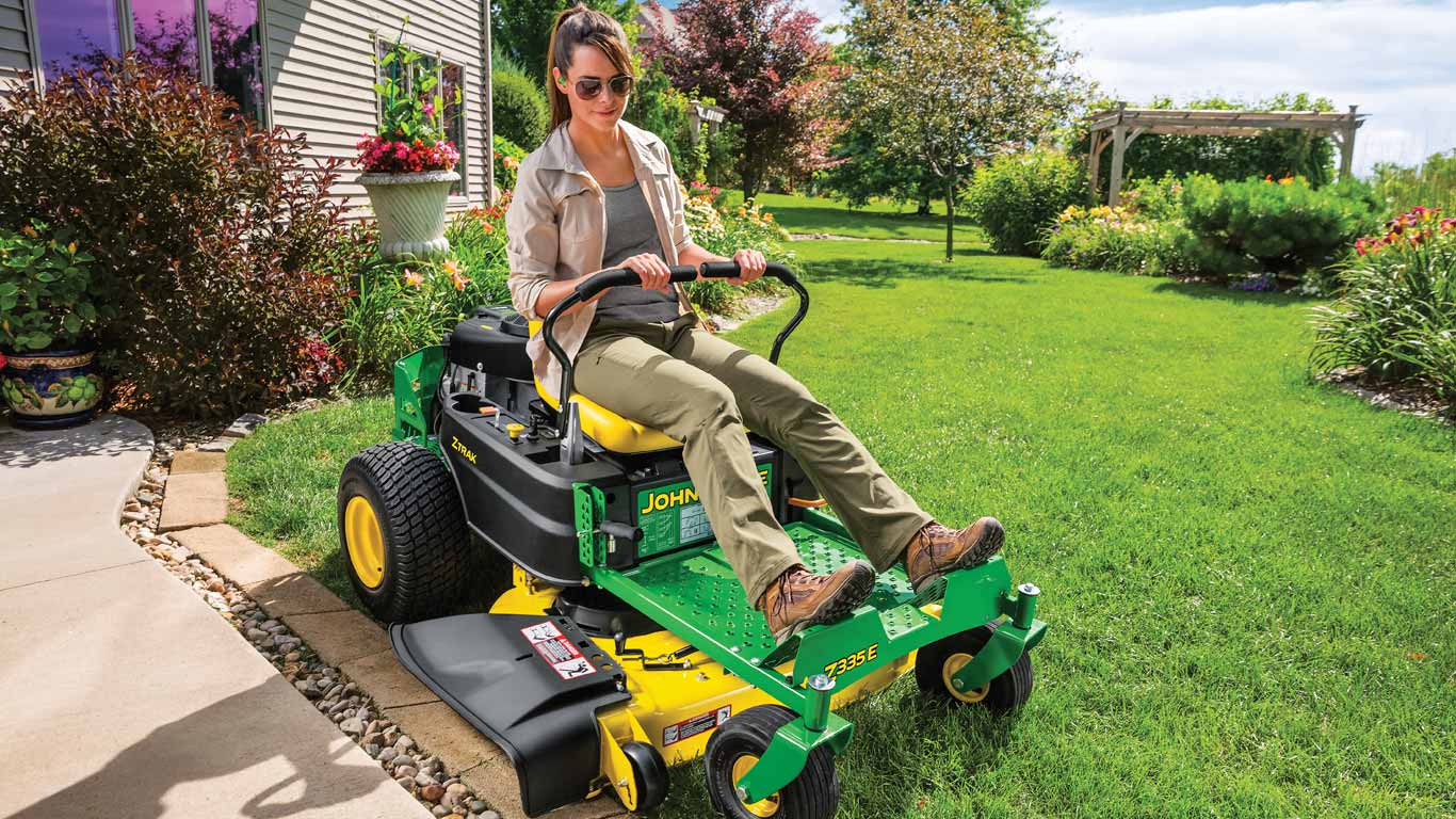 field image of women on a Z300-Series ztrak mower