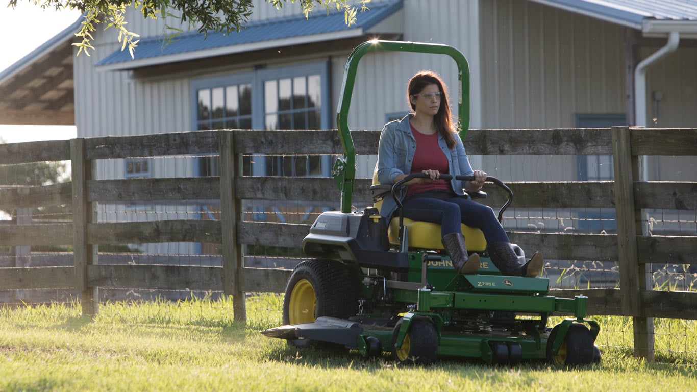 field image of women on a Z700-Series ztrak mower