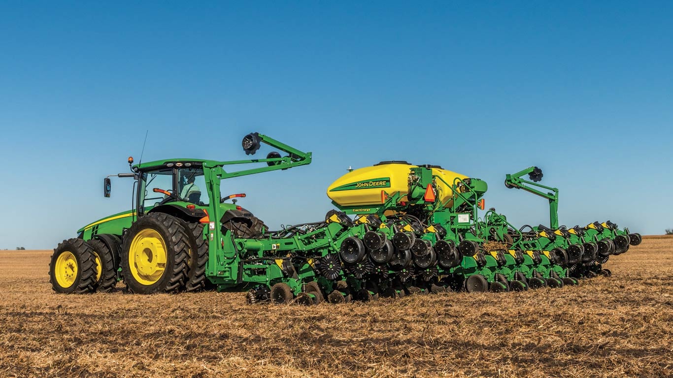 John Deere Drawn planter in field