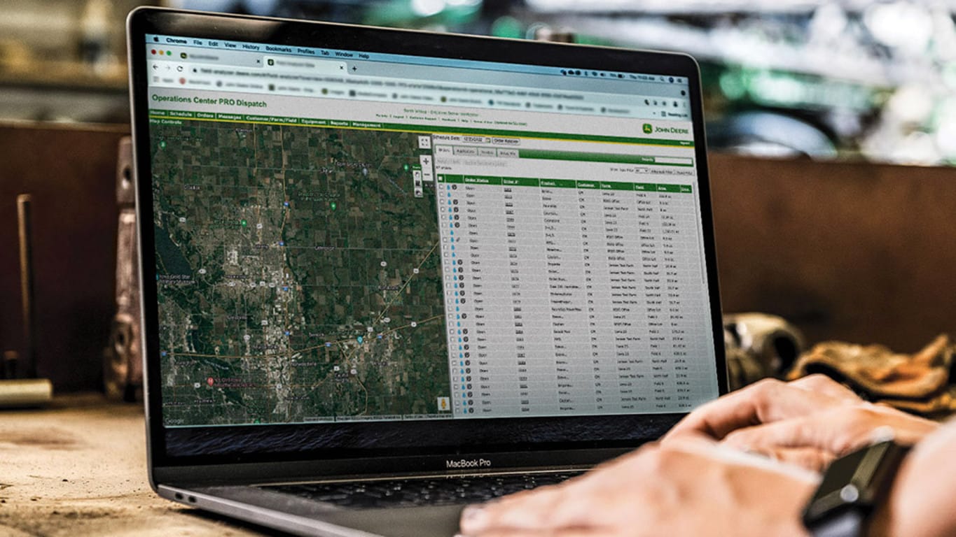 a laptop with the Operations Center PRO Dispatch screen loaded