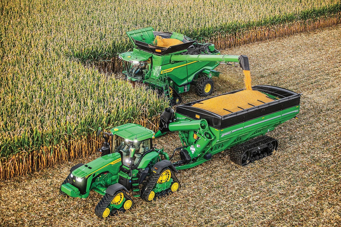 Machine Sync assisting two Deere tractors in a corn field