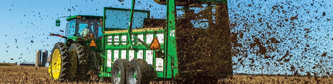 Frontier Hydraulic-Push 8030 Series Manure Spreader in a field.