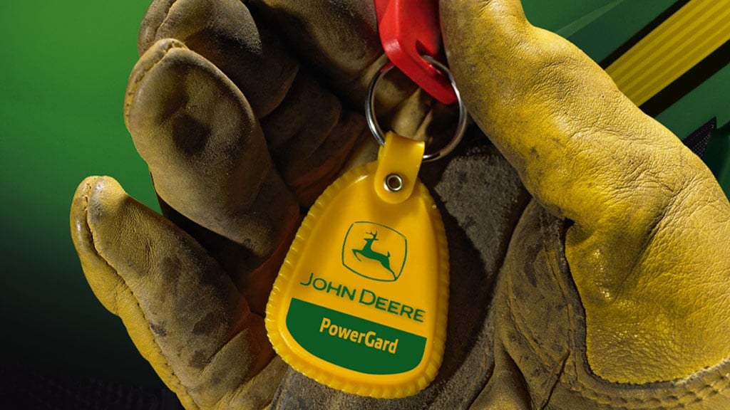 close up image of gloved hand holding keys