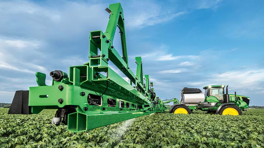 See & Spray Premium Precision Upgrade Self-propelled sprayer with a See & Spray Premium Precision Upgrade target spraying herbicide in soybean field.