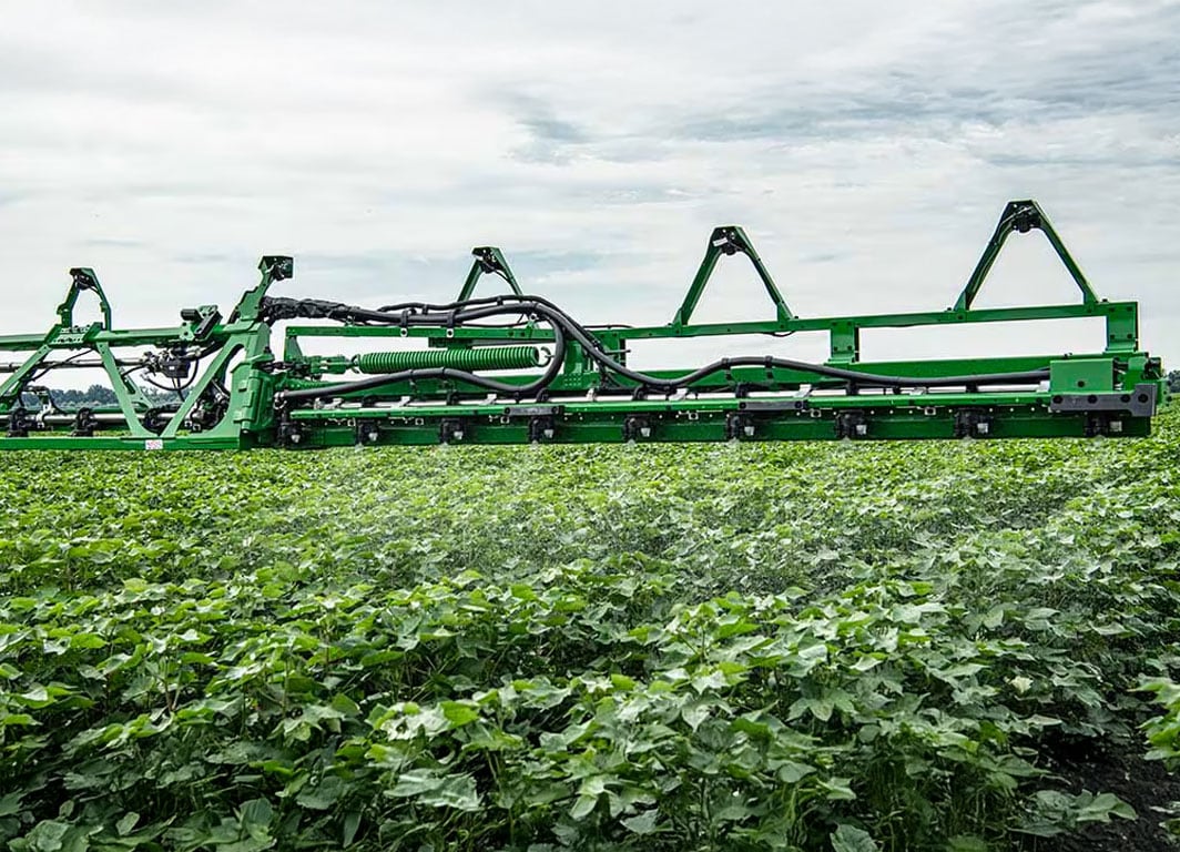See & Spray Boom spraying field with cameras.