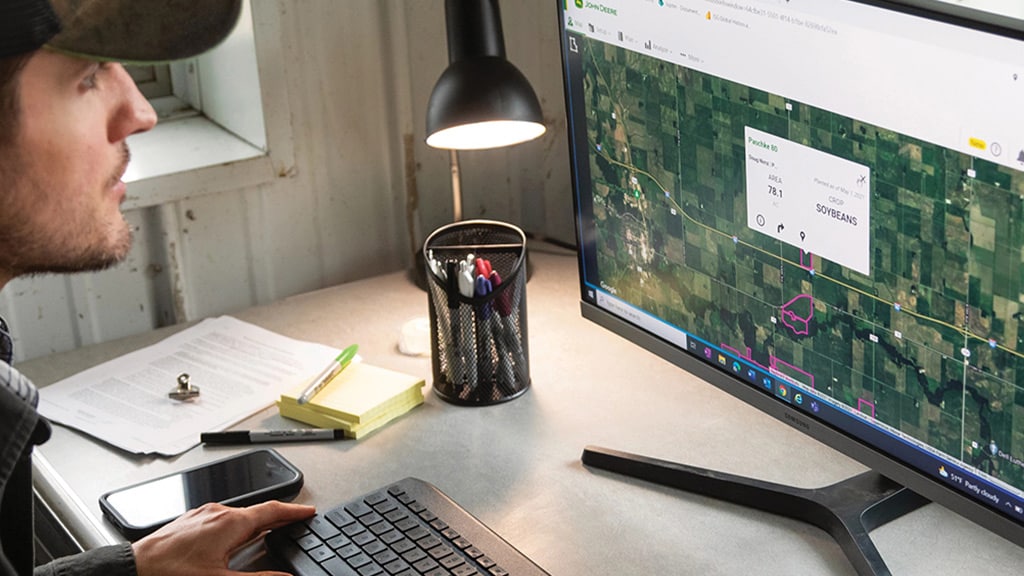 Man looking at maps in Operations Center on computer