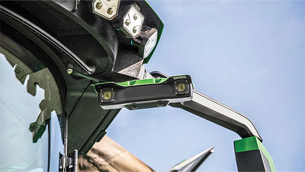 Combine cab display showing the John Deere Harvest Automation interface with real-time data including grain loss, foreign material, broken grain, and yield metrics.