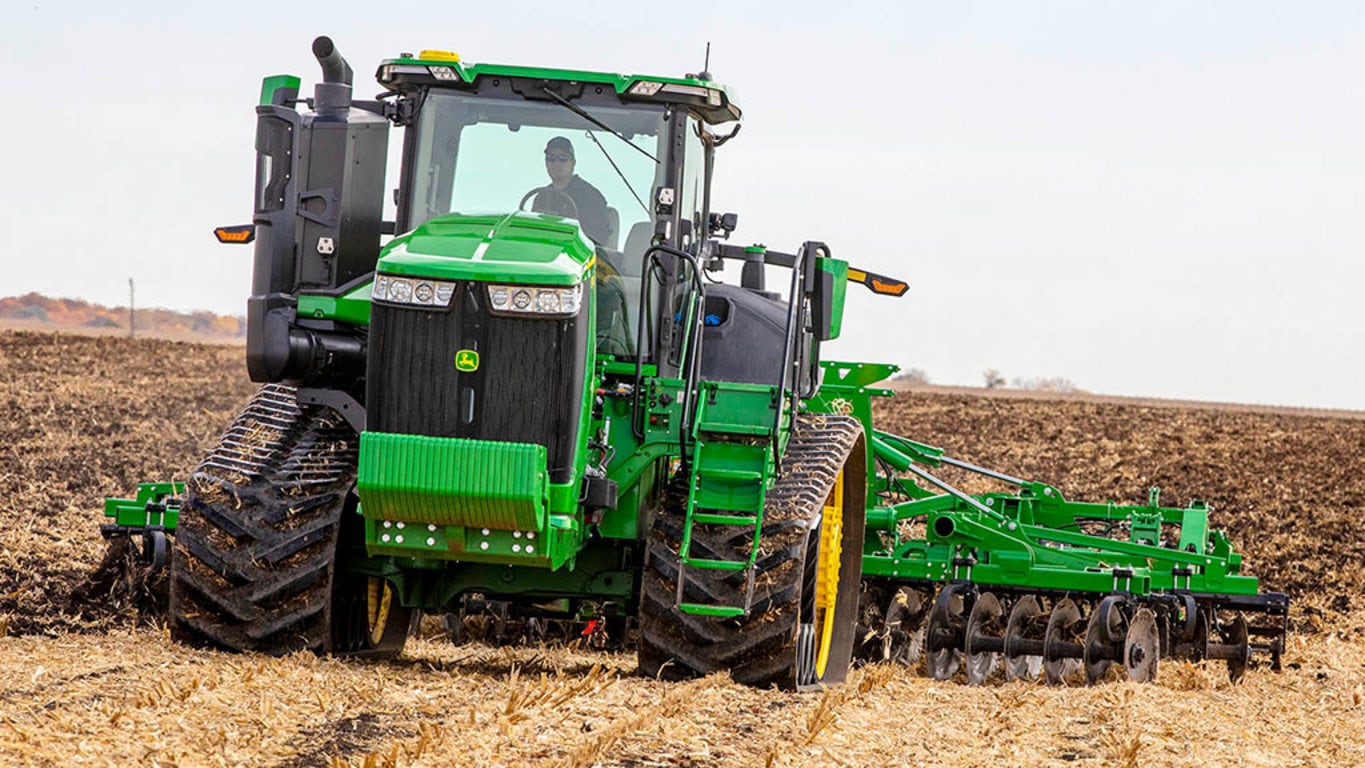 Image of a 9RT 490 Tractor tilling a field