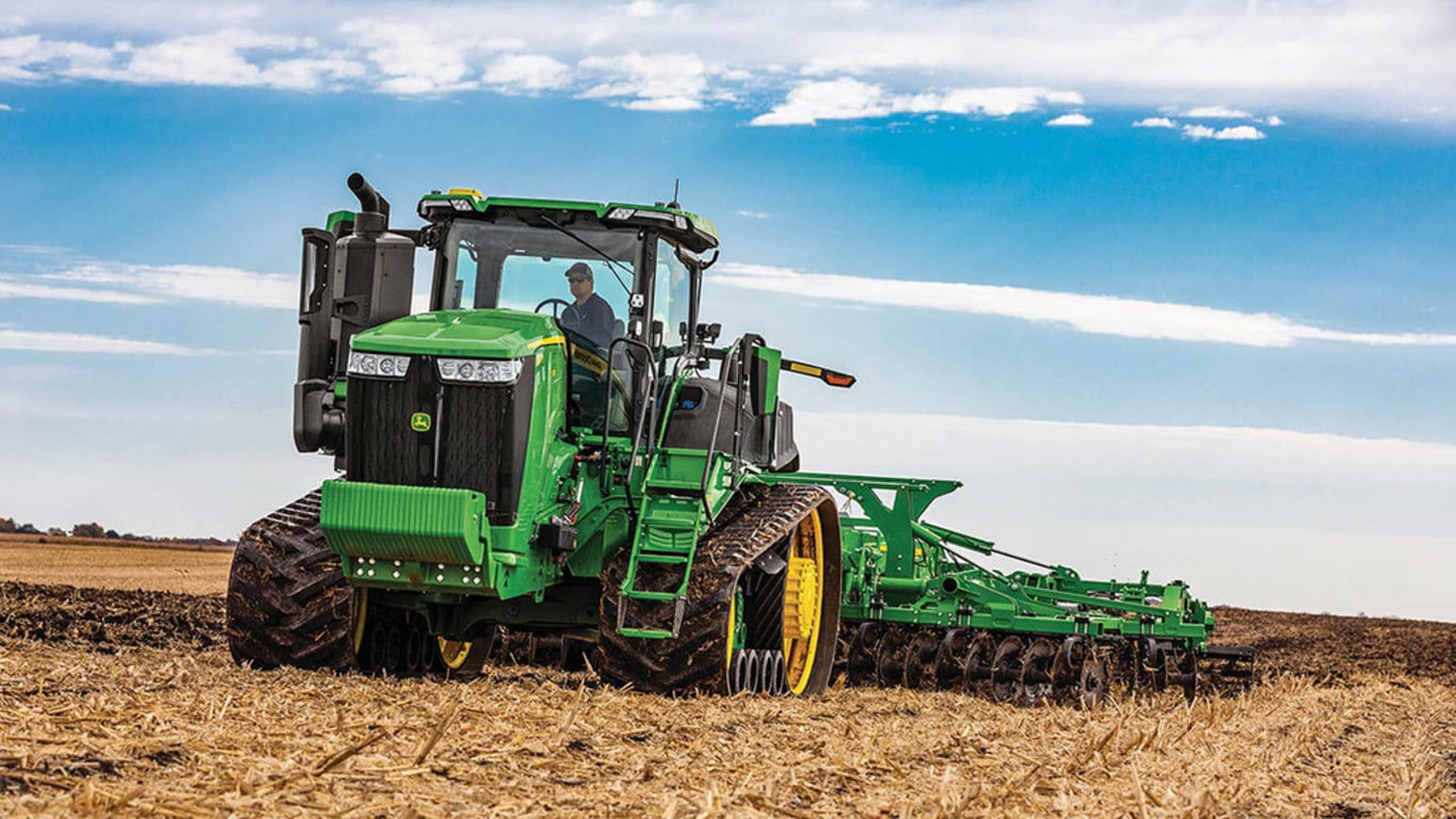 Image of a 9RT 540 Tractor tilling a field