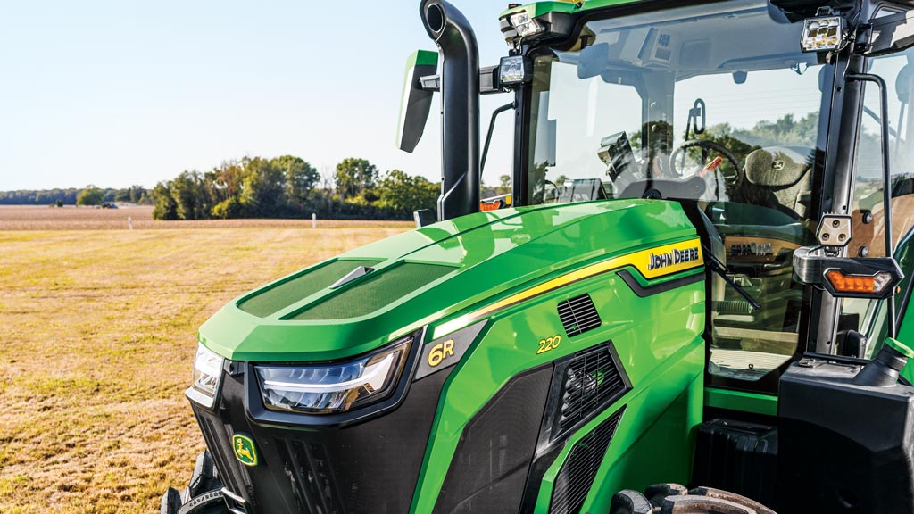 Front view image of the large windshield and windows for a 6R tractor.