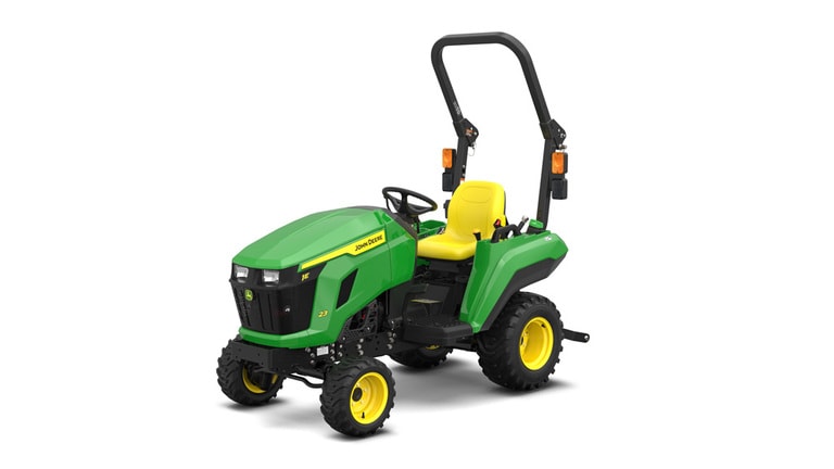 A front-left-facing studio shot of a green compact tractor on a white background.