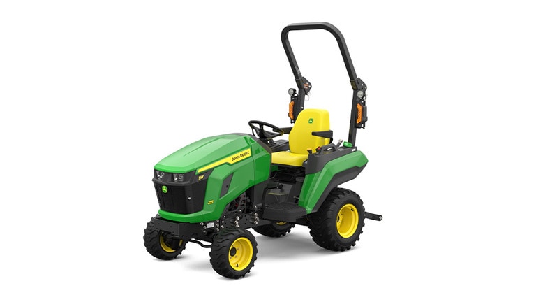 A front-left-facing studio shot of a green compact tractor on a white background.