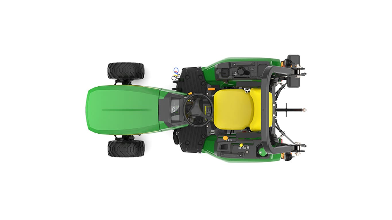 A top-down studio shot of a green compact tractor on a white background.