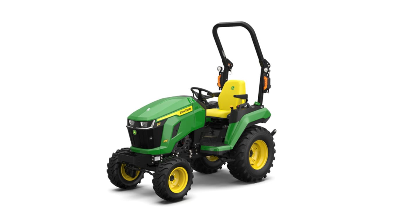 A front-left-facing studio shot of a green compact tractor on a white background.