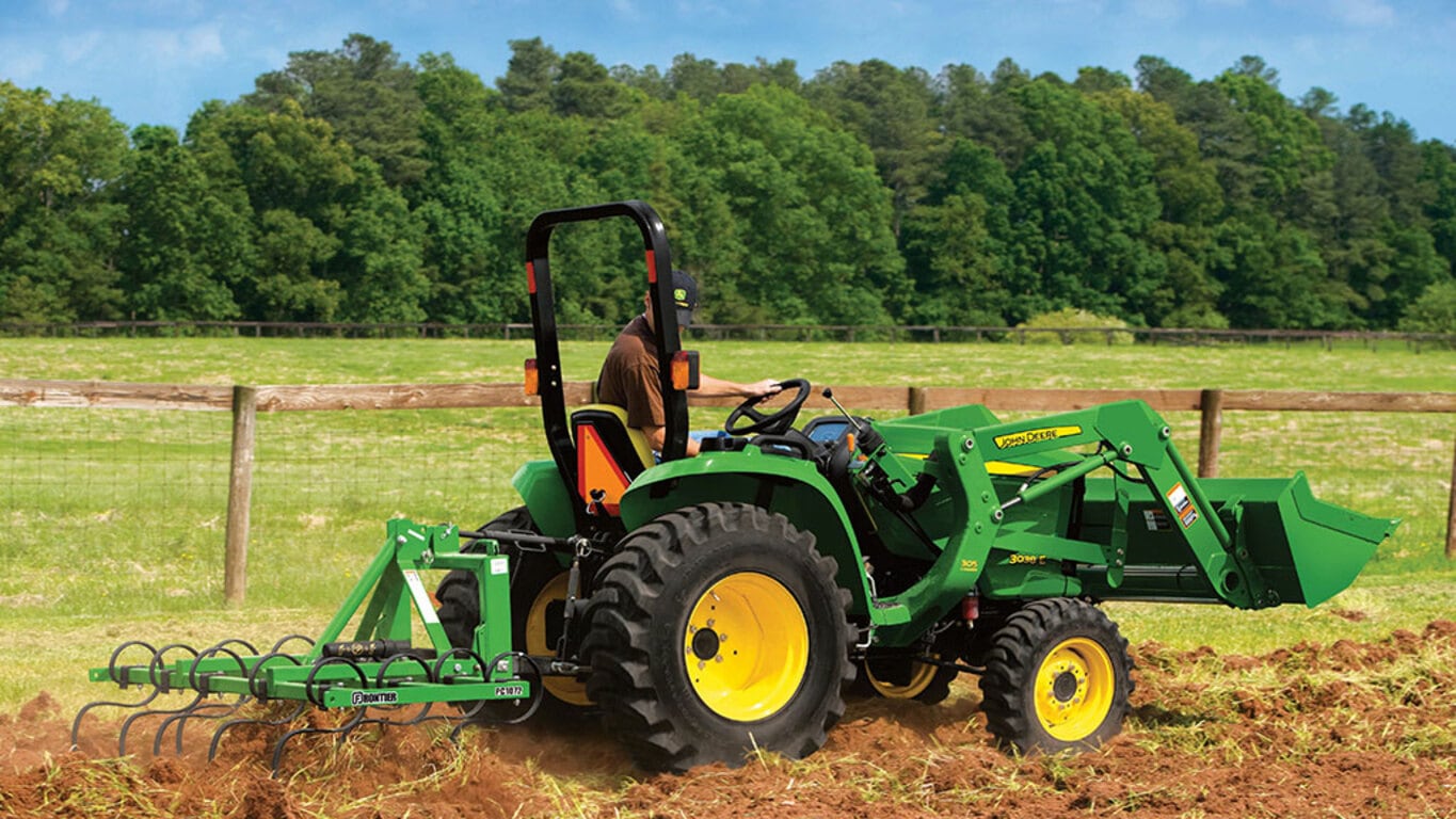 2024 John Deere 3038E Utility Tractor plowing dirt